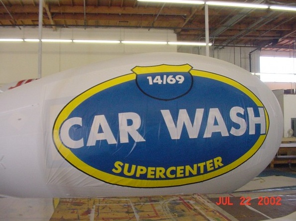 White Blue Advertising Car Wash Supercenter Blimp