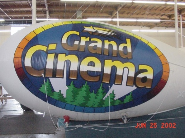 White Blue Advertising Grand Cinema Blimp
