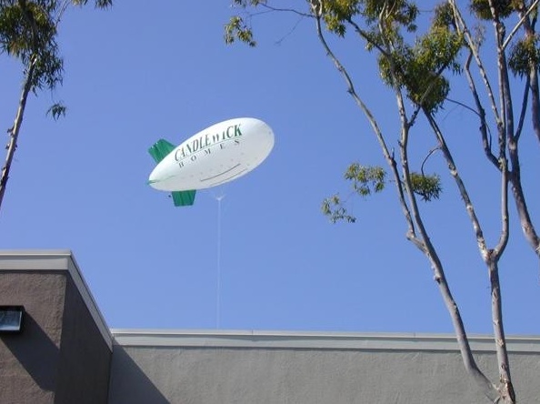 White Green Advertising Candle Duck Homes Blimp